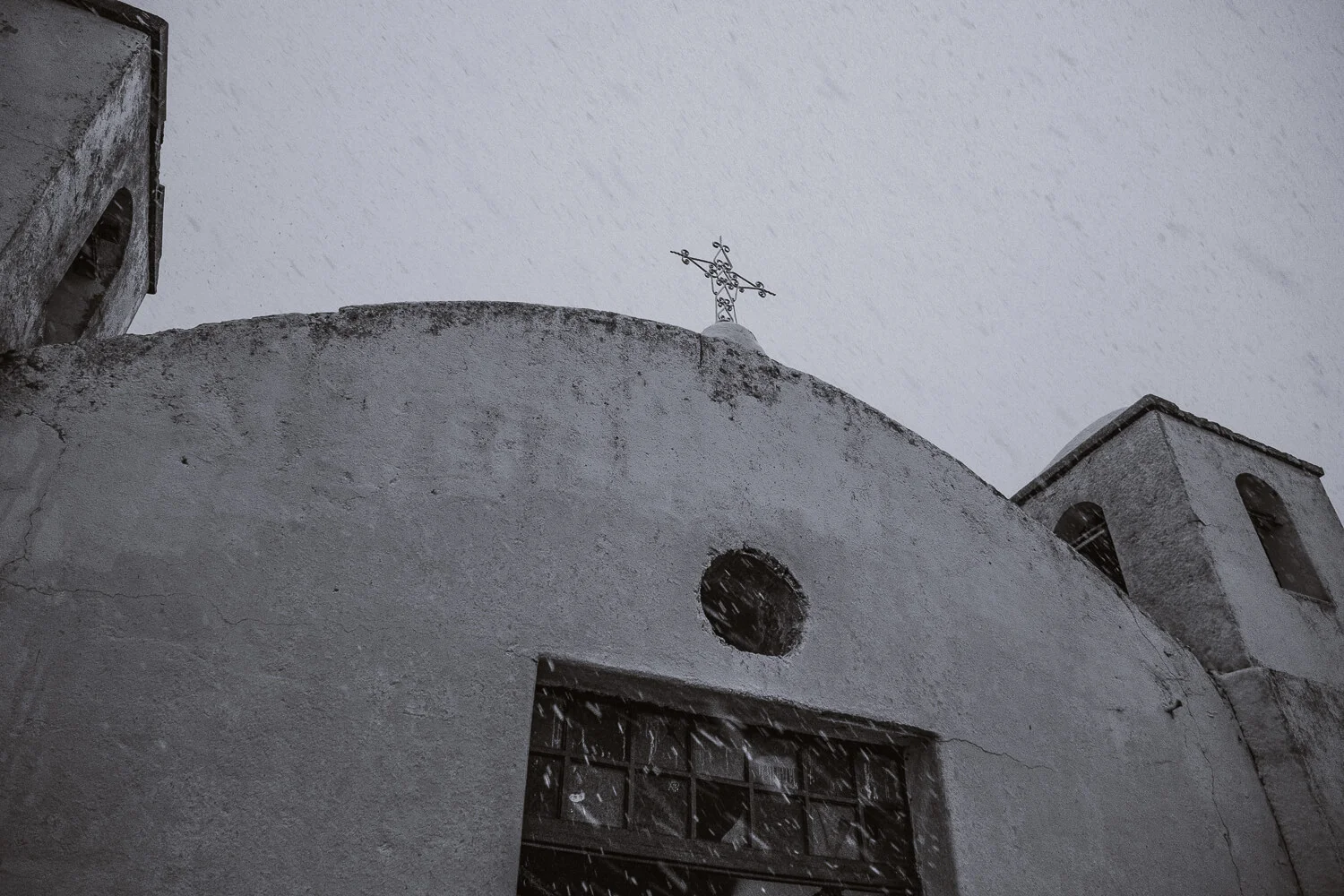 Blizzard at a church in the Andes. Travel photography and guide by © Natasha Lequepeys for "And Then I Met Yoko". #peru #sacredvalley #cusco #laketiticaca #belmondandeanexplorer #perurail #perutrain #luxurytravel #sleepertrain #photoblog #travelblog #travelphotography #fujifilm #andes #travel #travelperu #cuscotolaketiticaca #spiritofthelake #belmond #puno #southamerica