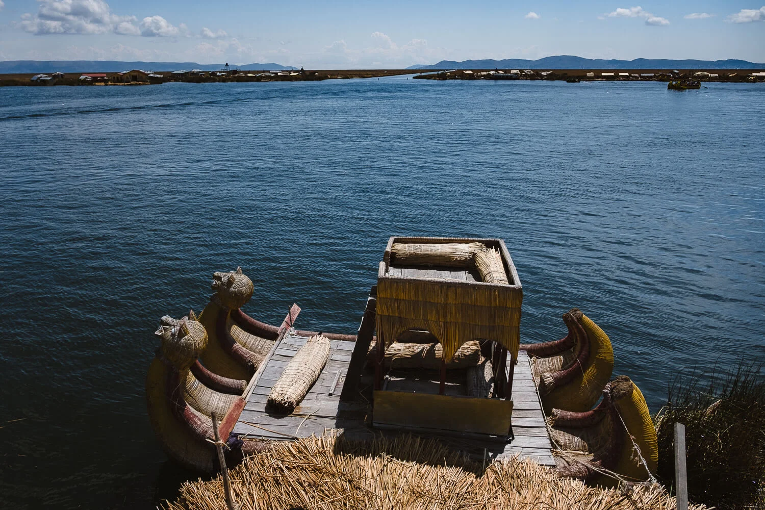 The reed boat, Uros Island. Travel photography and guide by © Natasha Lequepeys for "And Then I Met Yoko". #peru #laketiticaca #amantani #taquile #homestay #culturalexperience #photoblog #travelblog #travelphotography #fujifilm #travel #travelperu #southamerica #allwaystravel #laketiticacaitinerary #puno #uros #floatingislands #pachamama #pachatata