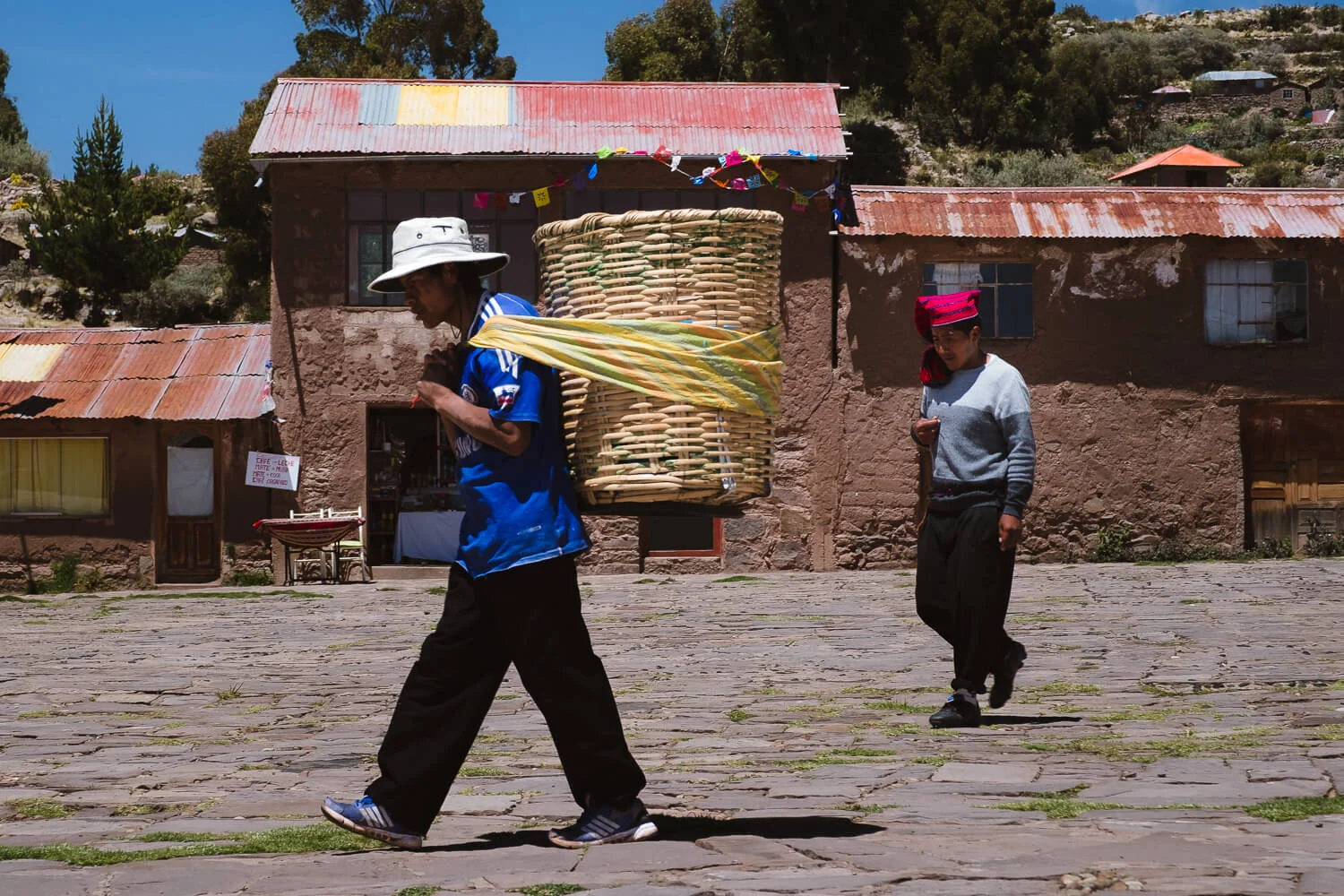 Men working in main square, Taquile Island. Travel photography and guide by © Natasha Lequepeys for "And Then I Met Yoko". #peru #laketiticaca #amantani #taquile #homestay #culturalexperience #photoblog #travelblog #travelphotography #fujifilm #travel #travelperu #southamerica #allwaystravel #laketiticacaitinerary #puno #uros #floatingislands #pachamama #pachatata