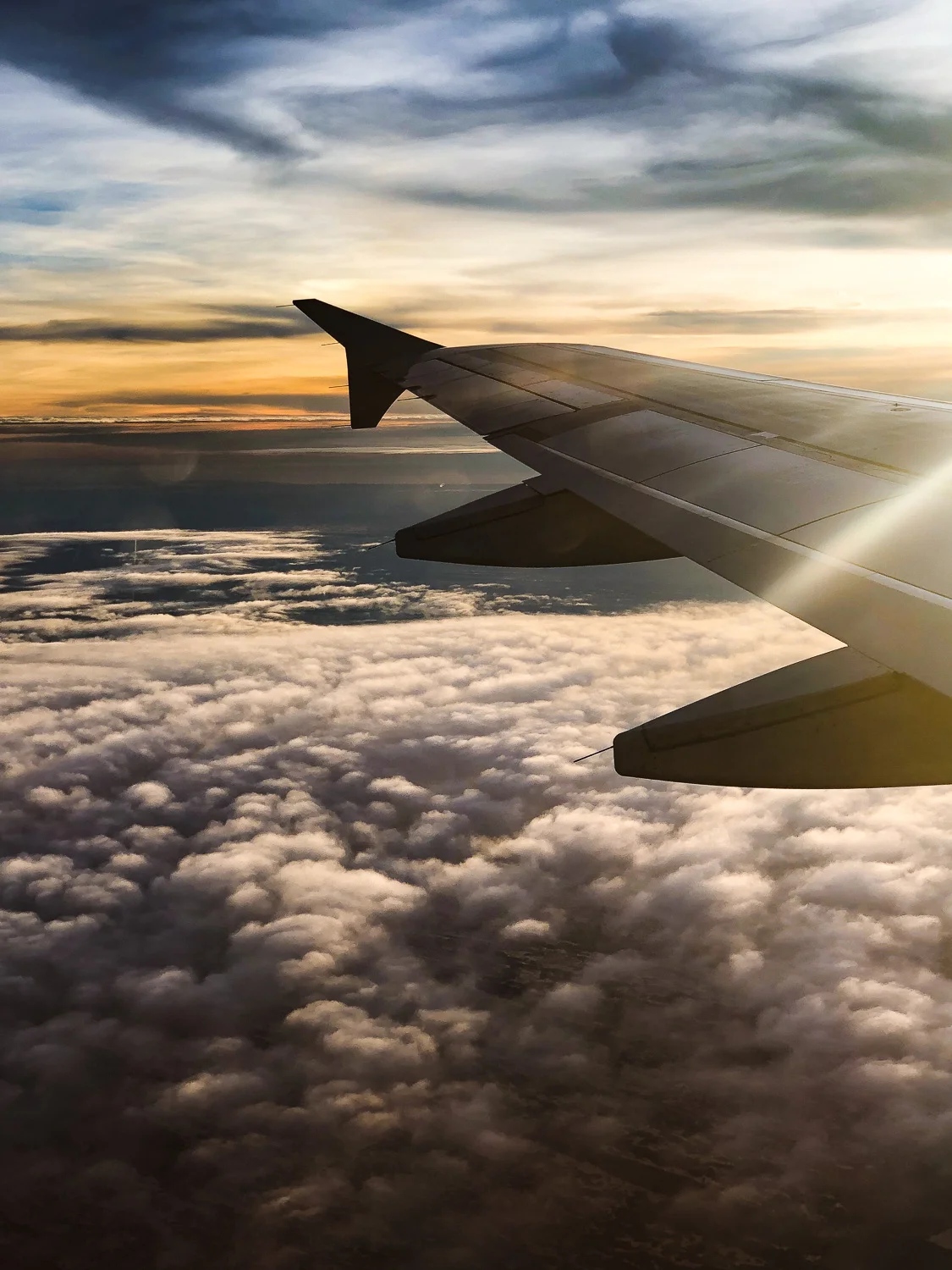 Flying over clouds. View from the airplane.