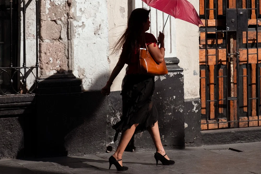 Woman walking on the street in Arequipa, Peru. Travel photography and guide by © Natasha Lequepeys for "And Then I Met Yoko". #peru #photoblog #fujifilm