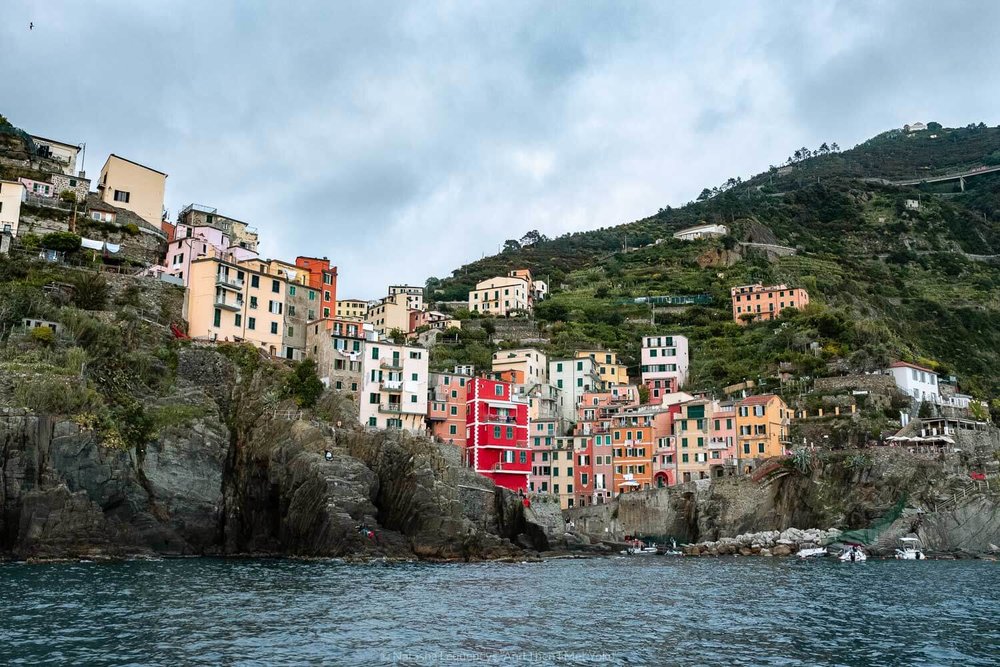 Riomaggiore from the water, Cinque Terre. Travel photography and guide by © Natasha Lequepeys for "And Then I Met Yoko". #cinqueterre #italy #travelphotography