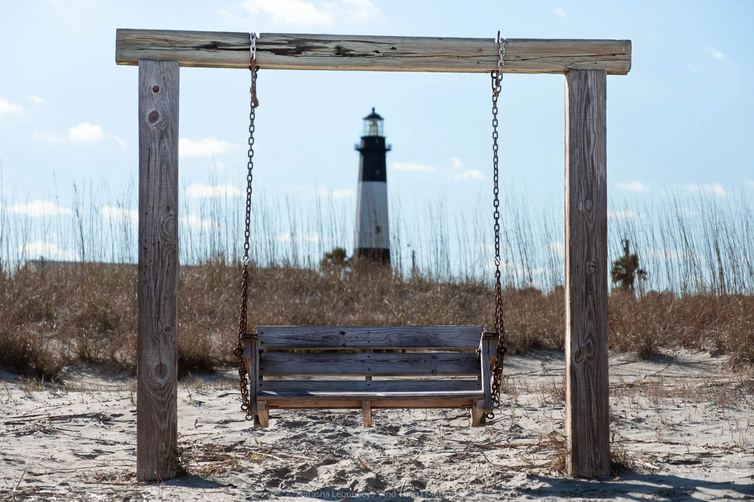 A wooden bench on the beach in Tybee Island - Savannah, Georgia. Travel photography and guide by © Natasha Lequepeys for "And Then I Met Yoko". #savannah #usa #travelguide #travelblog