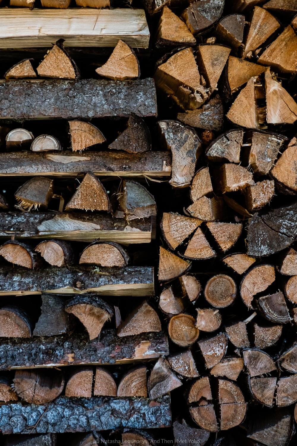 Stacks of chopped wood. Travel photography and guide by © Natasha Lequepeys for "And Then I Met Yoko". #wengen #jungfrau #travelphotography #switzerland