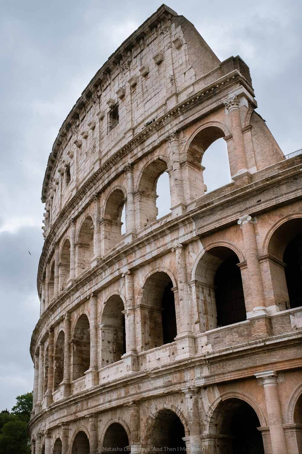 The outside of the Colosseum in Rome, Italy. Travel photography and guide by © Natasha Lequepeys for "And Then I Met Yoko". #rome #italy #travelblog #travelphotography