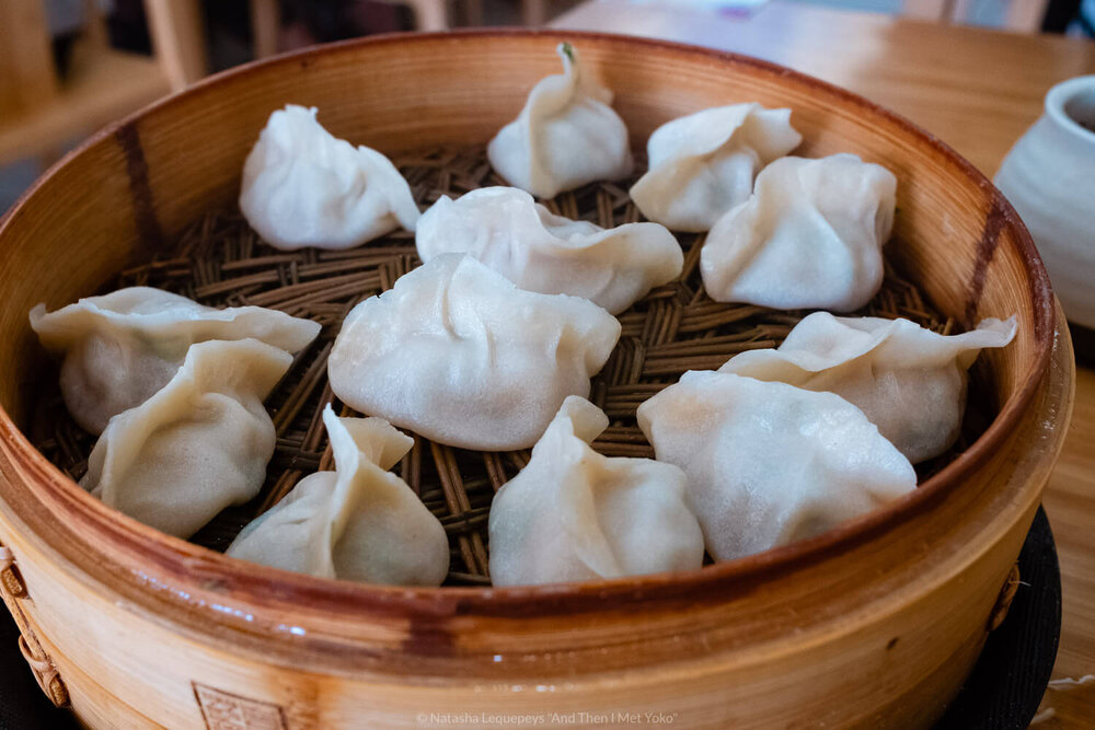 Steamed dumplings from QXY Dumplings in Chinatown Chicago, USA. Travel photography and guide by © Natasha Lequepeys for "And Then I Met Yoko". #chicago #usa #travelblog #travelphotography