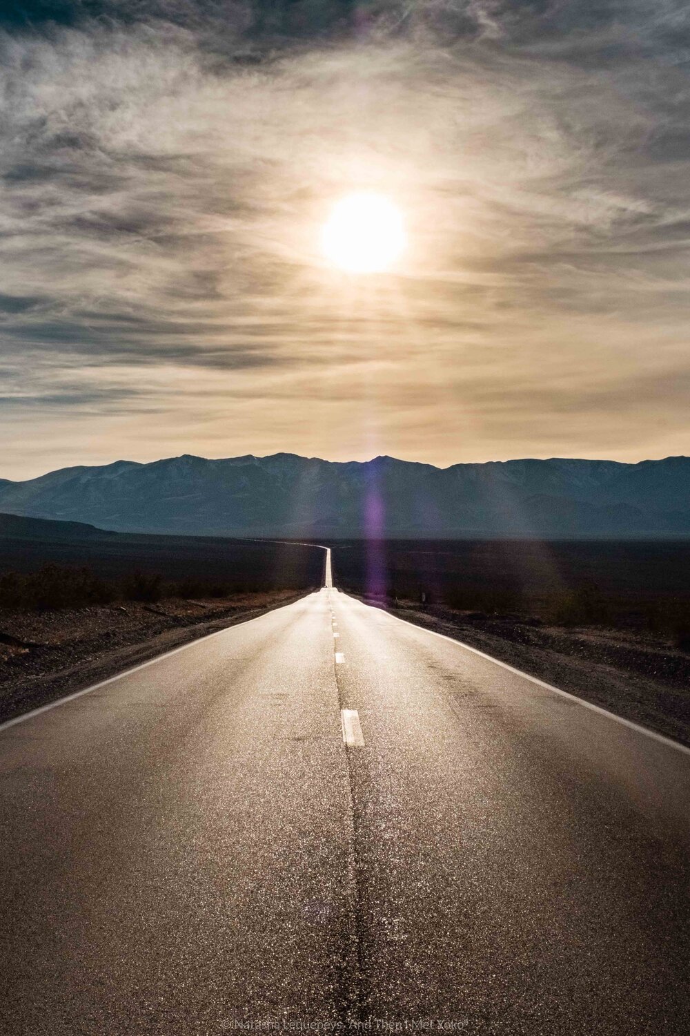 Long road in Death Valley, California. Travel photography and guide by © Natasha Lequepeys for "And Then I Met Yoko". #deathvalley #nationalpark #travelblog #travelphotography