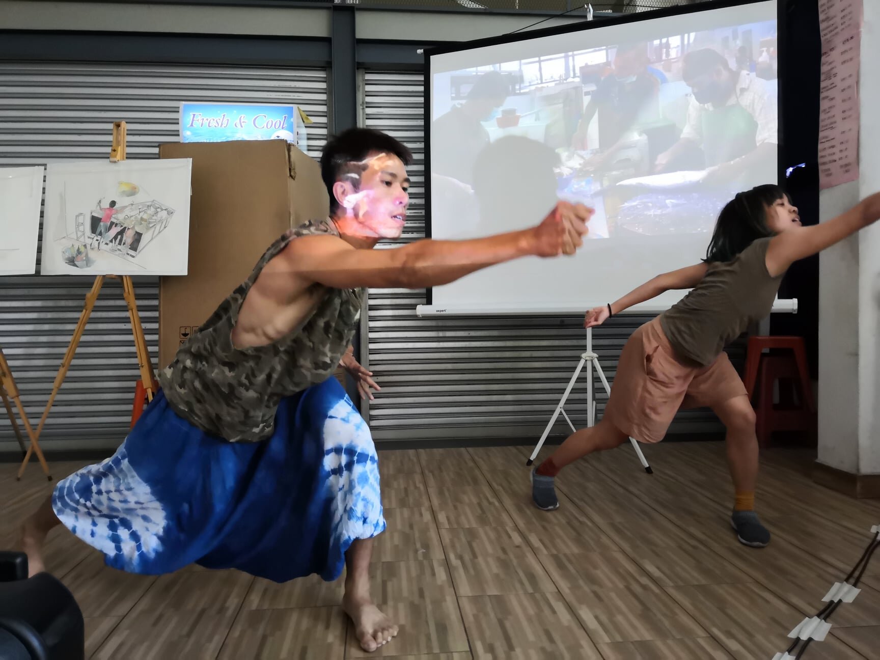  Two trainees performing a dance movement during the Mai Bincang session 