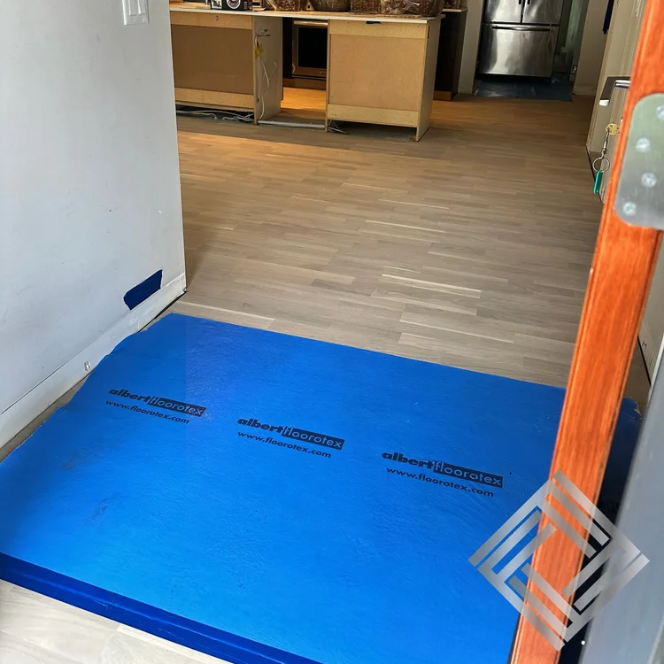 Waterproof vinyl flooring installation in a kitchen with island