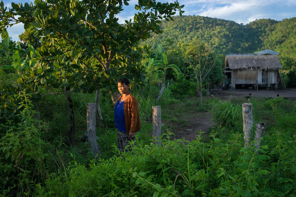  August 20, 2015 - Pis Village - Omlaing (Cambodia). Ms. Pheun Ra (40) in front of her house. In 2010 she was evicted and forced to move with her family in the resettlement village and was given a small plot of land (40x50m) to farm. © Thomas Cristof