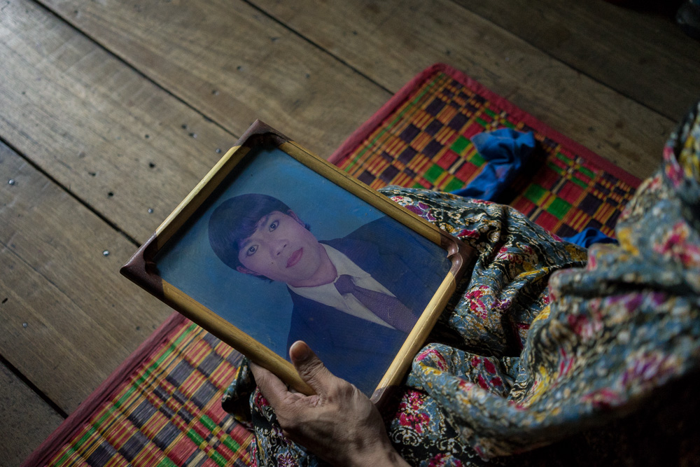  August 05, 2014 - Phnom Penh. Champa holds an old photo of her taken for an ID card. Aside from the general provisions in its Constitution, Cambodia has no laws specifically protecting or recognizing members of the LGBT community against discriminat