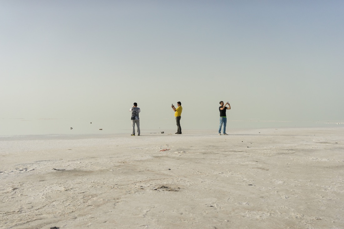  June 08, 2014 - Urmia, Iran. Iranian youths take pictures of the surface of Urmia lake with their smartphones. Despite slow mobile internet connections, Iran has seen a considerable increase of consumers purchasing smartphones. © Thomas Cristofolett