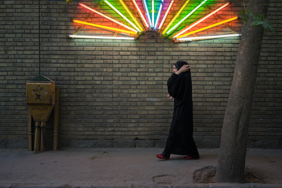  June 12, 2014 - Tehran (Iran). A woman walks in front of a light decoration installed to celebrate the birthday of Imam Mahdi. © Thomas Cristofoletti / Ruom 
