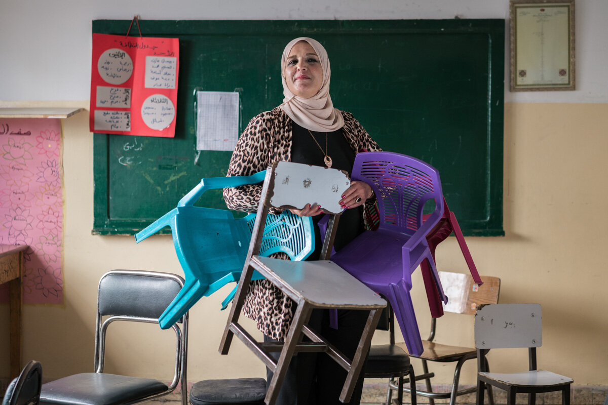  AMMAN, JORDAN - OCTOBER 1, 2015: Maha al Ashqar is the principal of Khawla Bint Tha’laba Primary Girls School in a suburb of Amman Jordan. The school, which has 356 students, hosts around 65 Syrian students—many of whom have fled violence and destru