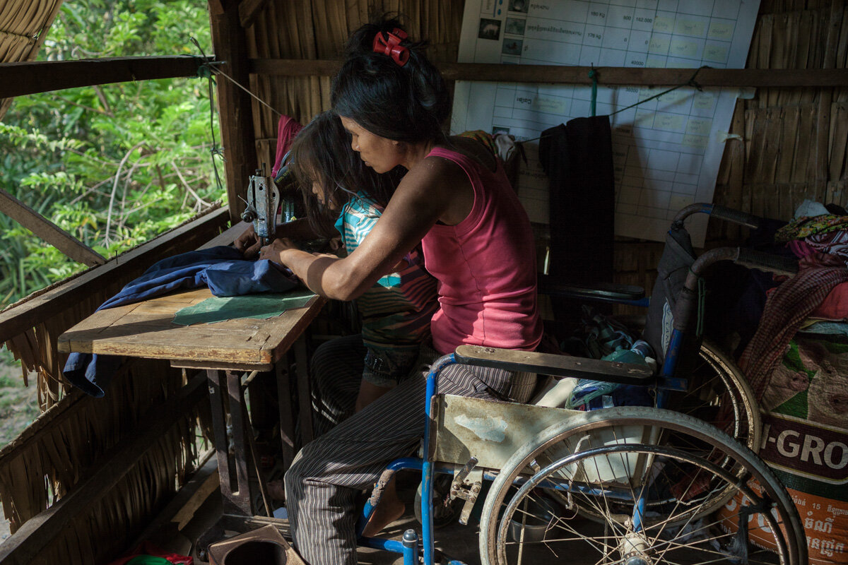  November 28, 2013 - Batheay village (Kompong Cham). Ms. So Yeou (50) received a tranining in sewing and she is now able to make some small incomes with this activity. She lost a leg when she stop on a landmine while she was working at her Bamboo far