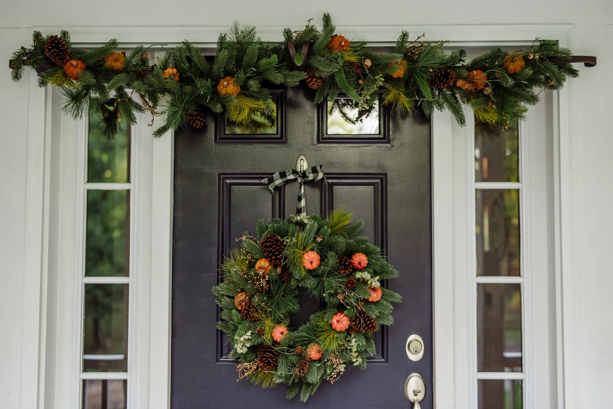 We hung one 6’ Classic Fraser Fir Festive Garland and Wreath. The garland is hung on Tree Classics double door Garland hange r—no nails needed! Though it definitely helps to have two people Hanging it.