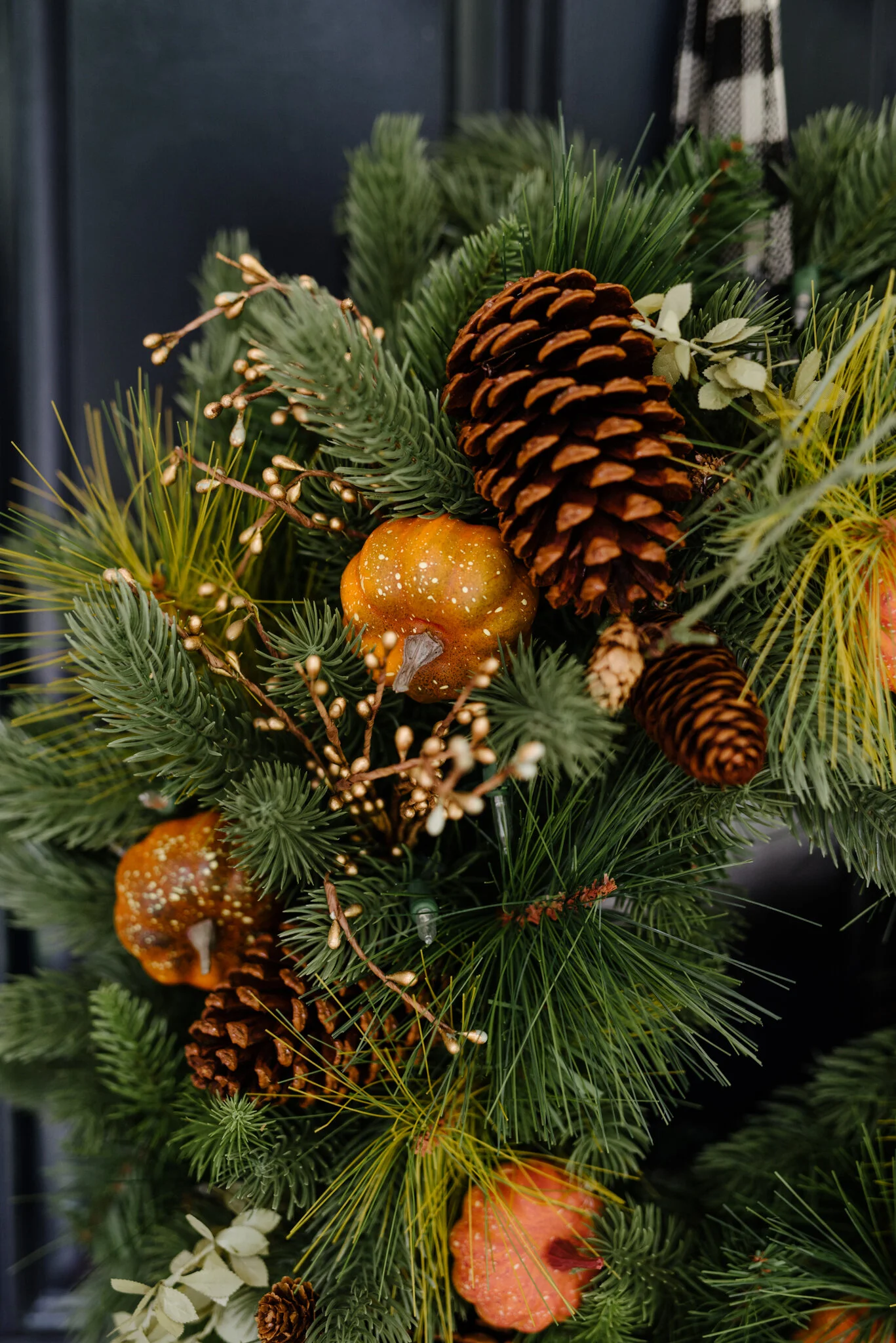 Tree Classics Classic Fraser Fir Festive Wreath . The wreath comes decorated with tiny gold buds, faux leaves, pinecones and real feel needles. I added the faux pumpkins for a bit of a fall touch.