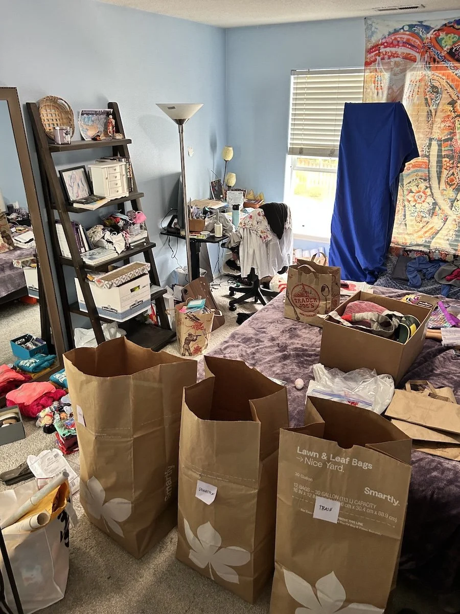 Messy, cluttered bedroom before decluttering and organizing support.