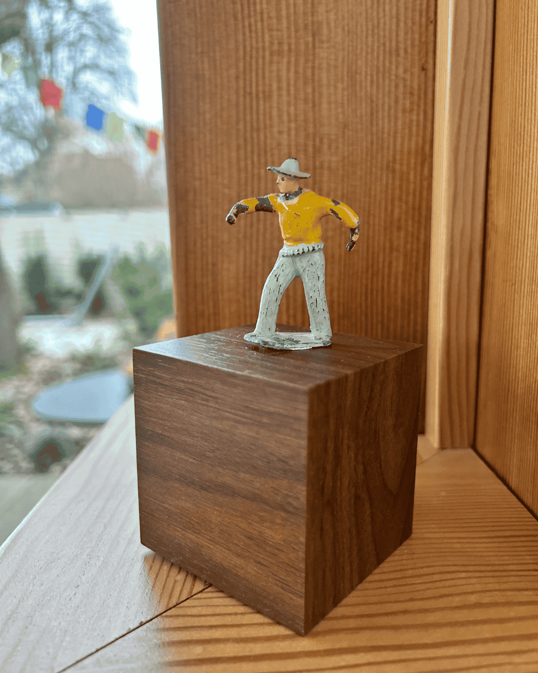 Curated decor displayed on a shelf to give a rental home a personal, intentional feel.