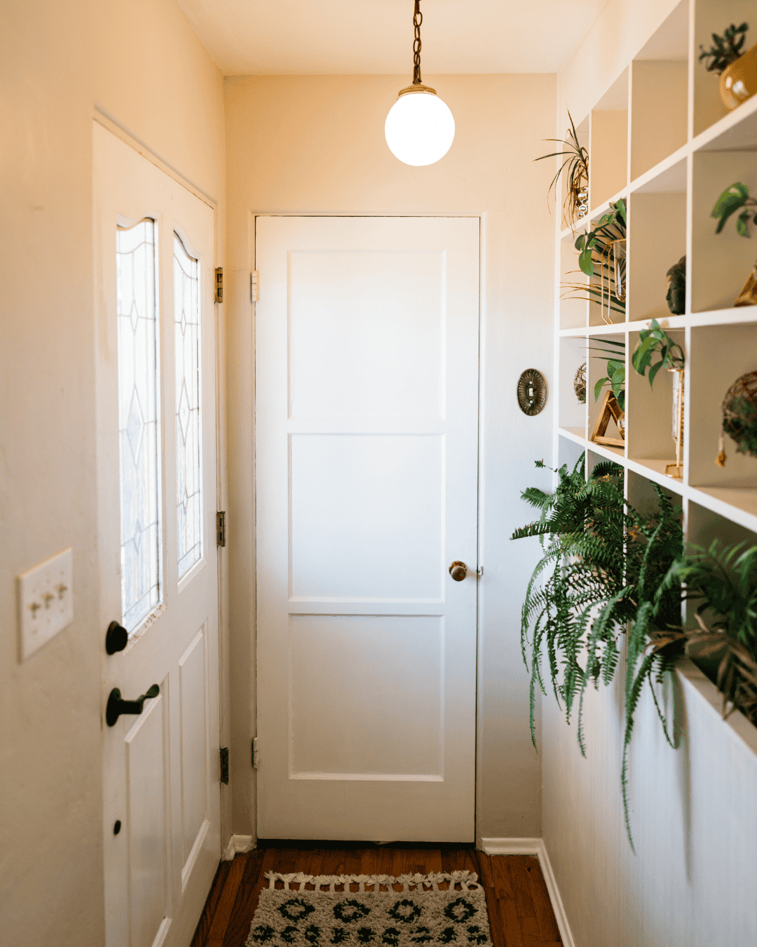 Decluttered entryway with functional storage that keeps everyday items easy to find.