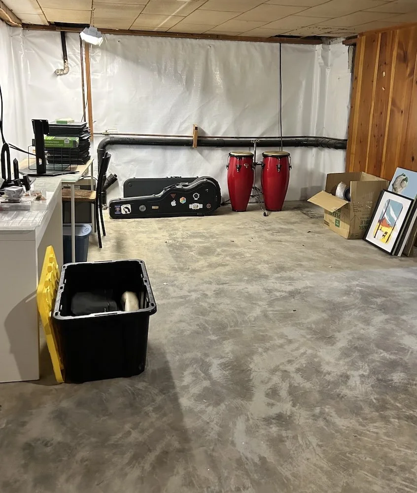 Organized basement with sorted belongings and donations ready to be passed on thoughtfully.