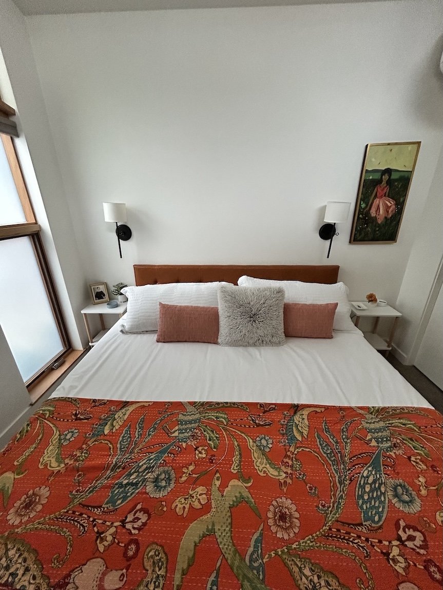 Clean, organized guest bedroom after decluttering and home organizing support.