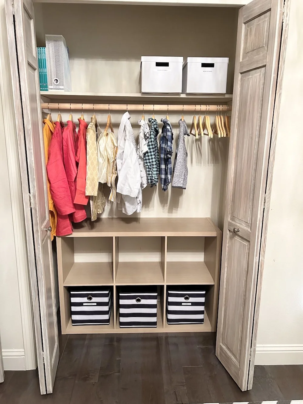 Organized shared kids closet with clearly defined storage for easy daily routines.