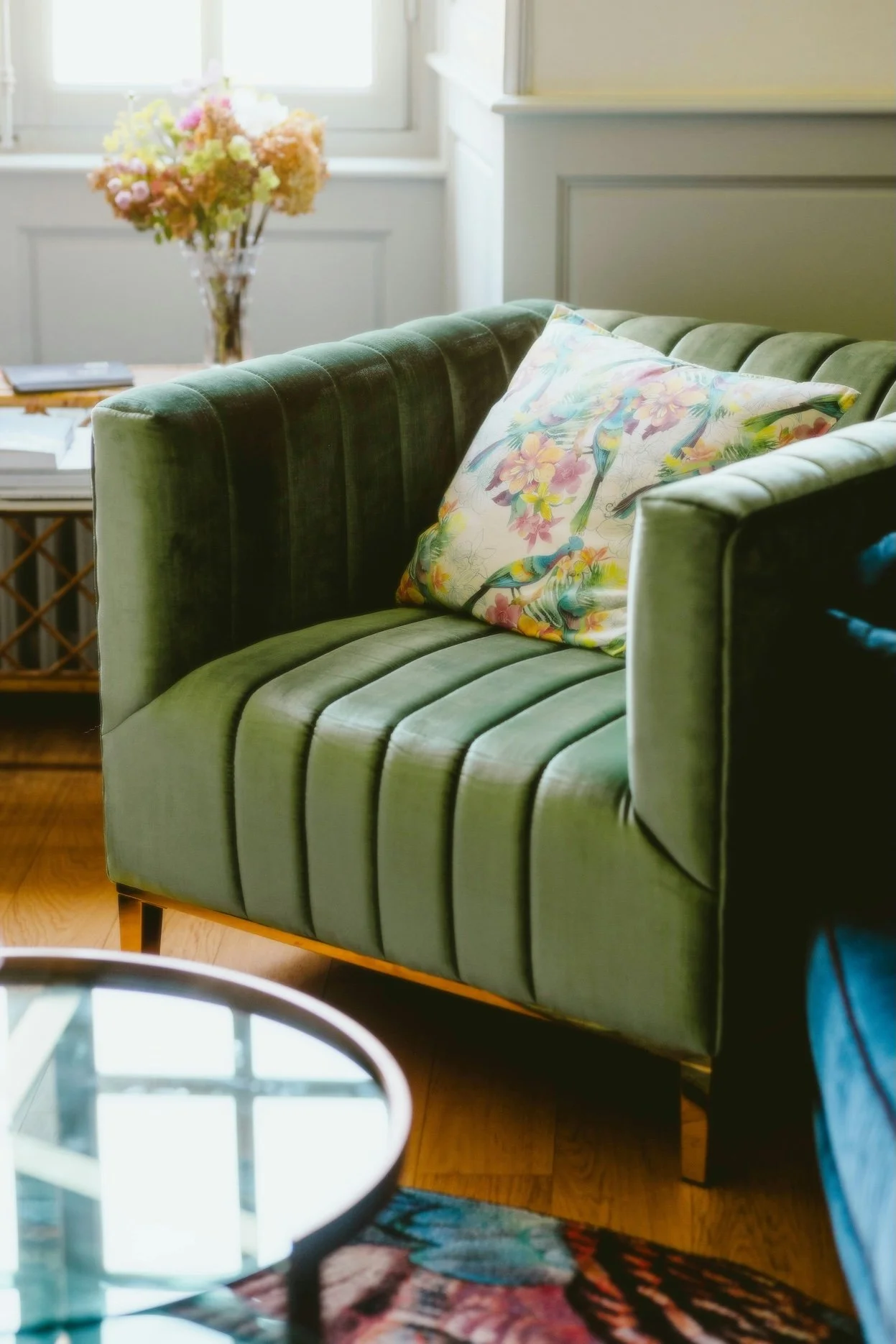 Green armchair in organized Portland living room.