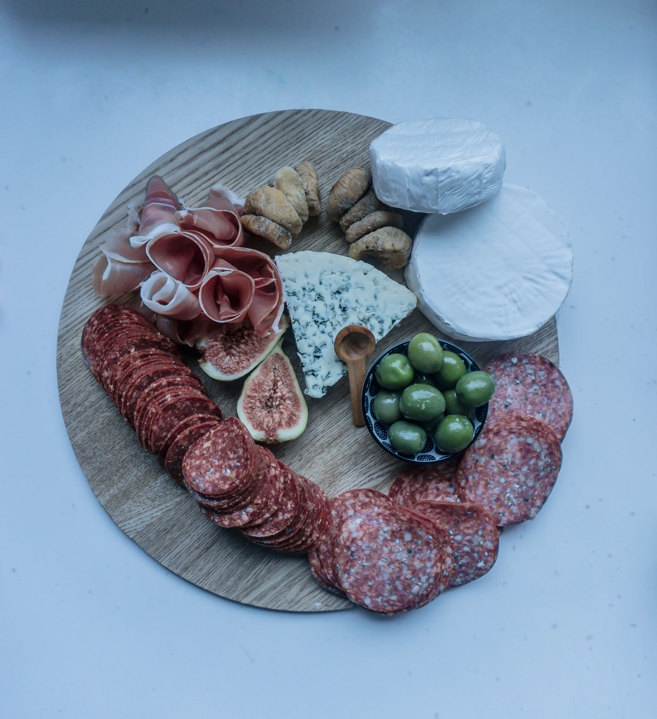 Group your meats together and curl your prosciutto around your fingers to get a perfect swirl