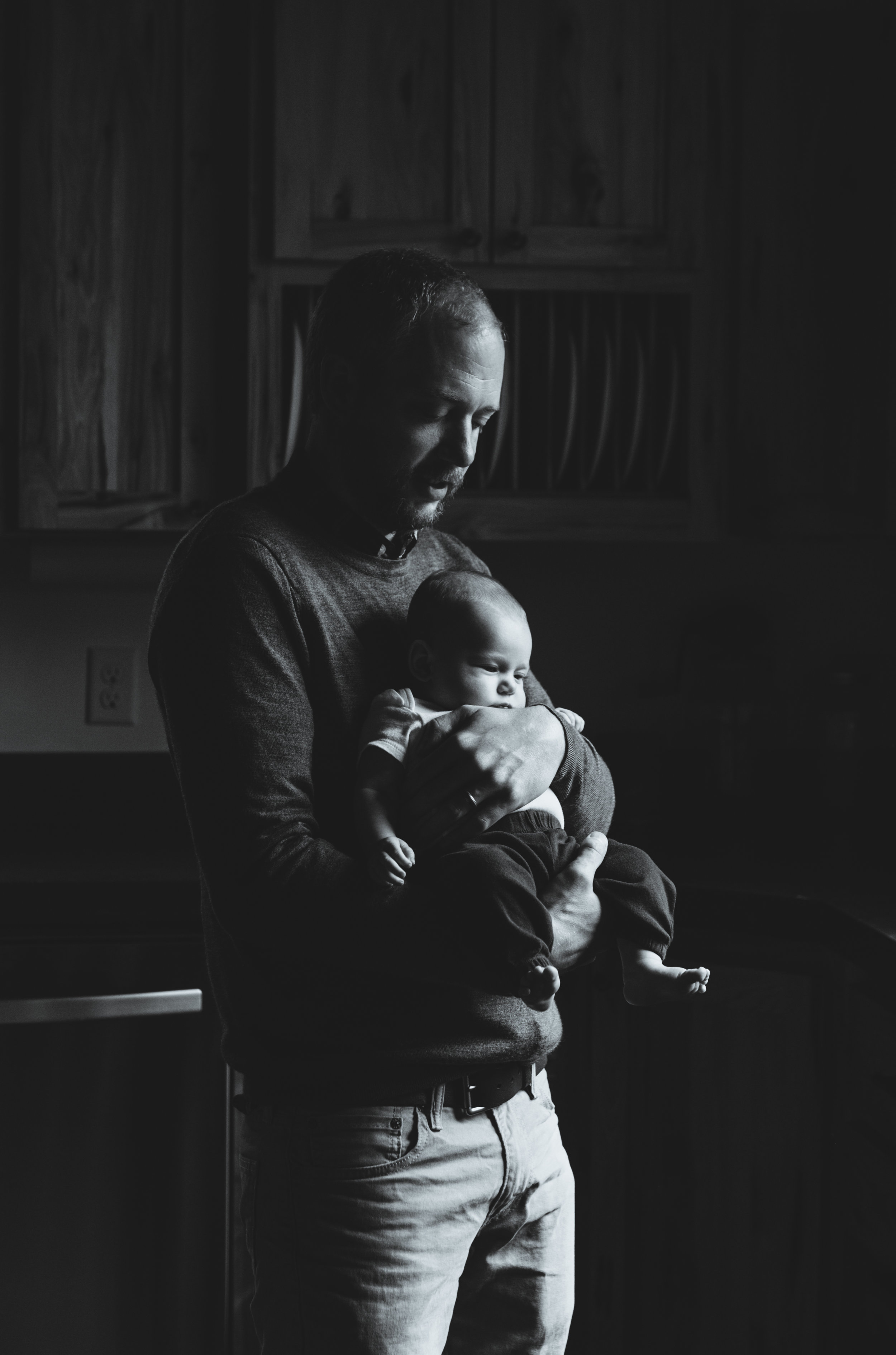 Dad holding newborn black and white photo | Jaime Bugbee Photography