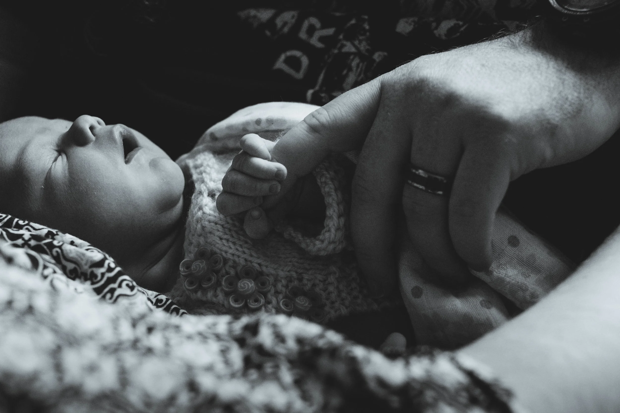 Dad holding newborn baby hand | Jaime Bugbee Photography