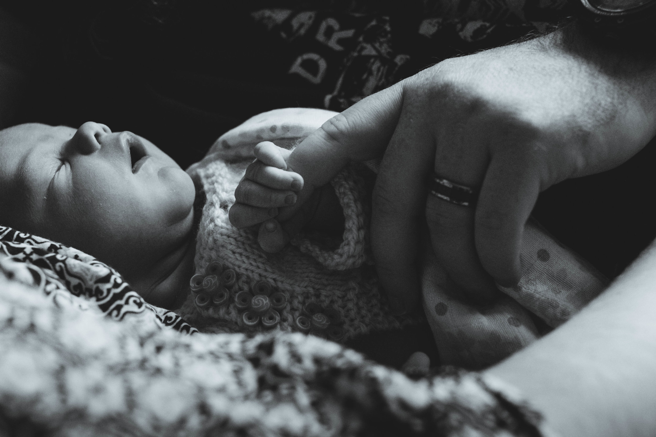 Dad holding newborn baby hand | Jaime Bugbee Photography