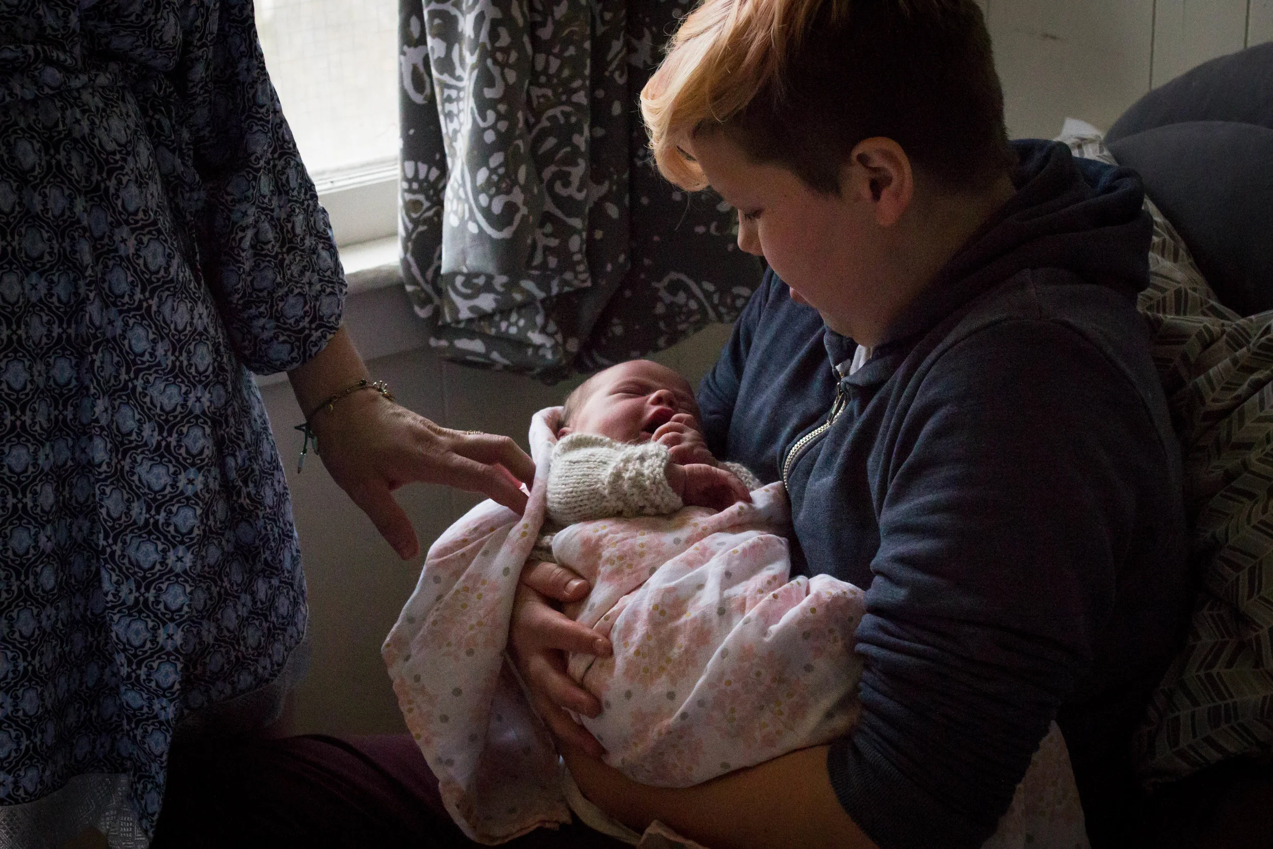 Big brother holding newborn | Jaime Bugbee Photography