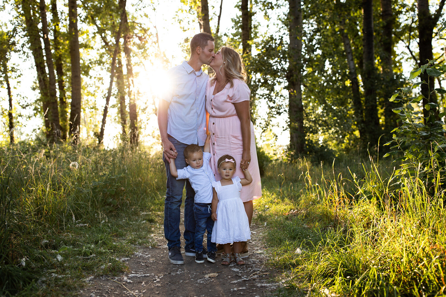 The best time of year for outdoor portrait photography | family of four in woods at sunset near Portland, Oregon.