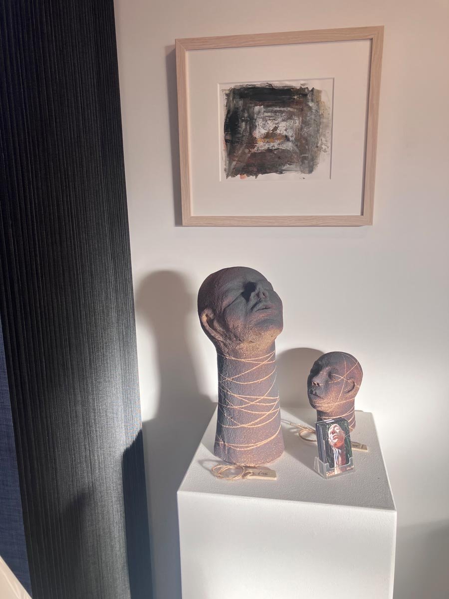 Painting by Penny Gambrill (SOLD),  Smoke Fired Stoneware Heads by Christine Burgess (SOLD)