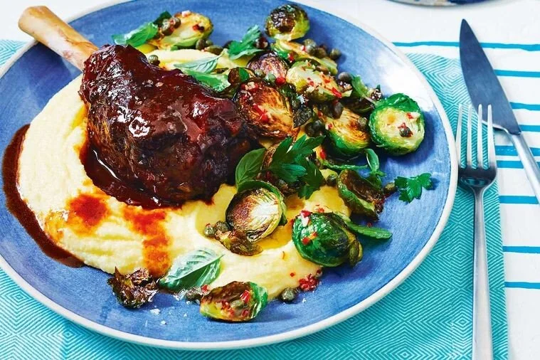 Pot-roasted lamb shanks with polenta and sprouts