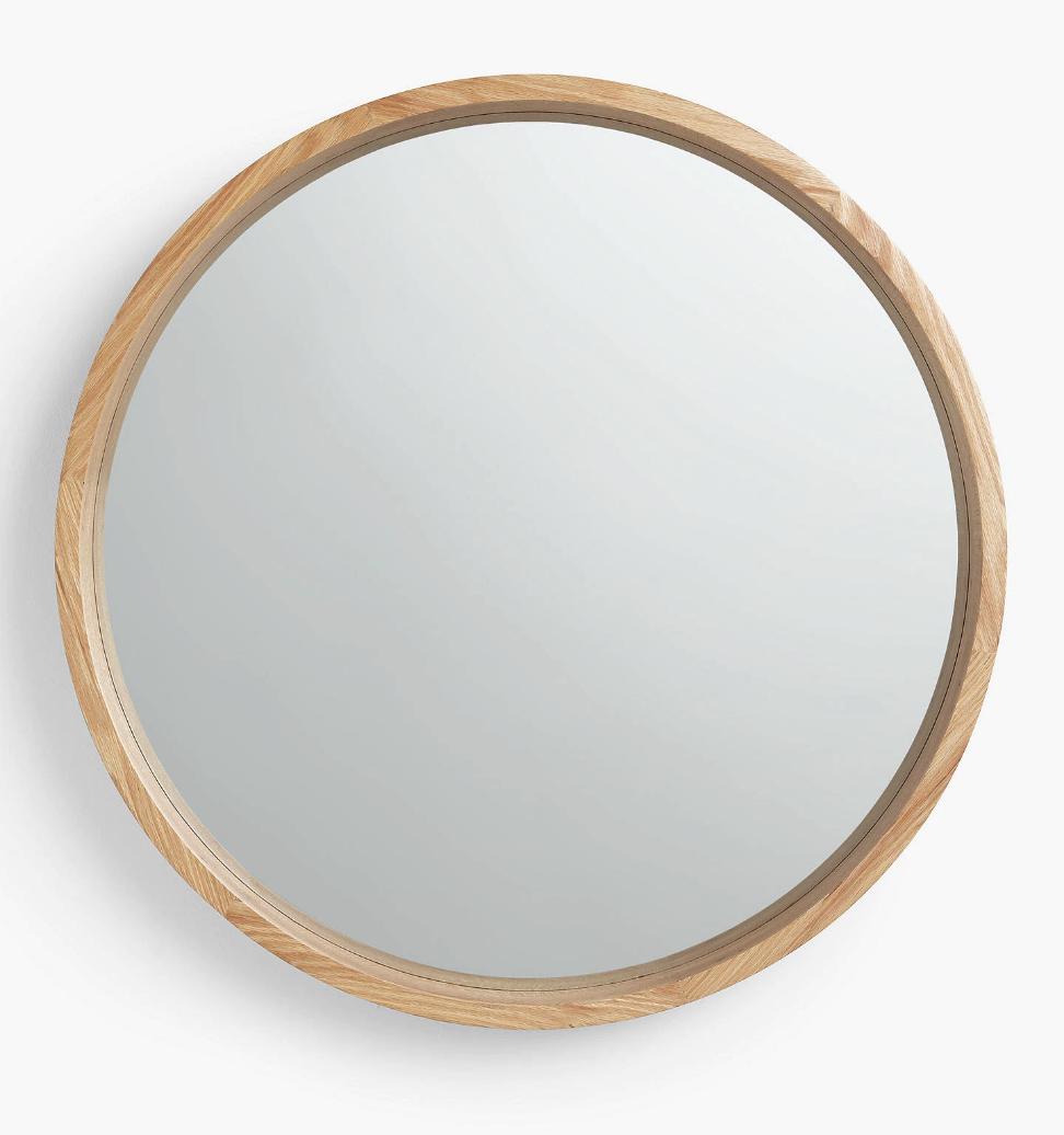 I like this mirror in oak wood from John Lewis. It’s very versatile and I always love bringing a bit of nature into home