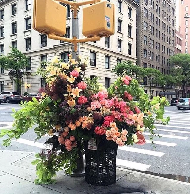 There is a flower shop in New York that artfully &quot;throws away&quot; their flowers in large installations in the NYC trash receptacles