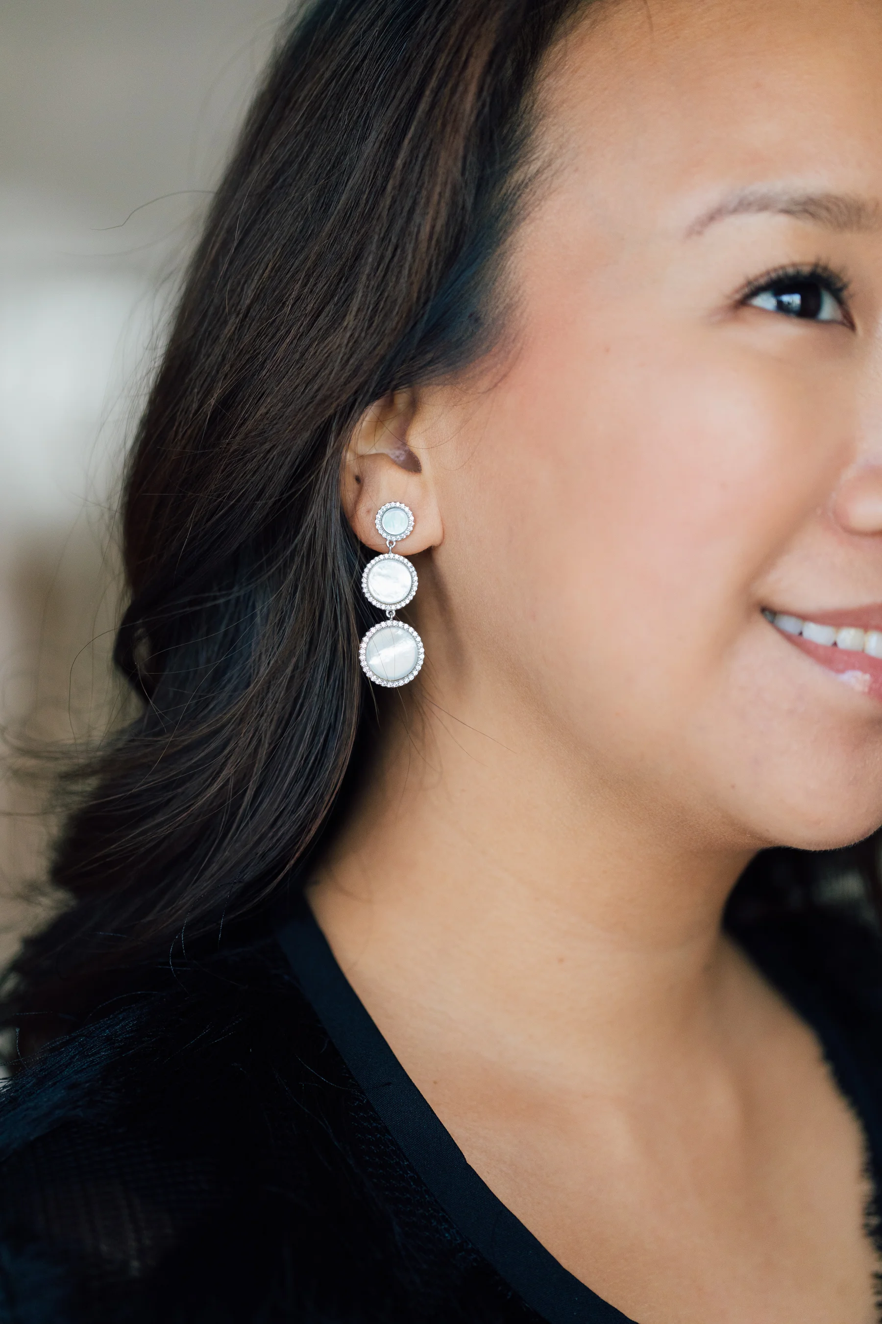 ... and Nyla Star's 3-tiered Mother-of-Pearl earrings are sure to complement any outfit!
