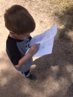 My son checking off his last item on the checklist.