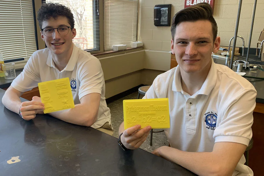 Students Adam and Devin with their projects