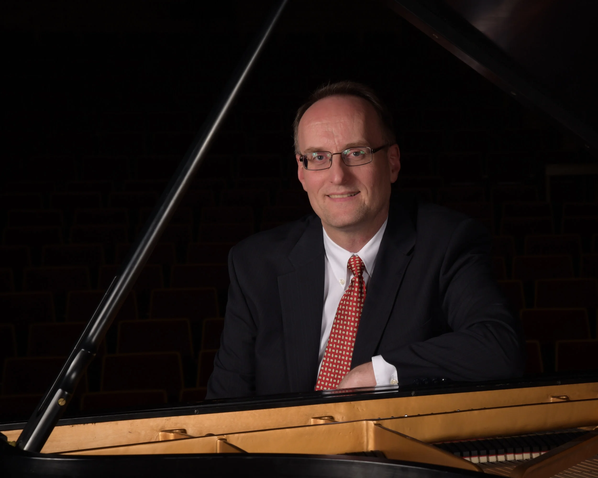 Stephen Thomas with Piano.jpg