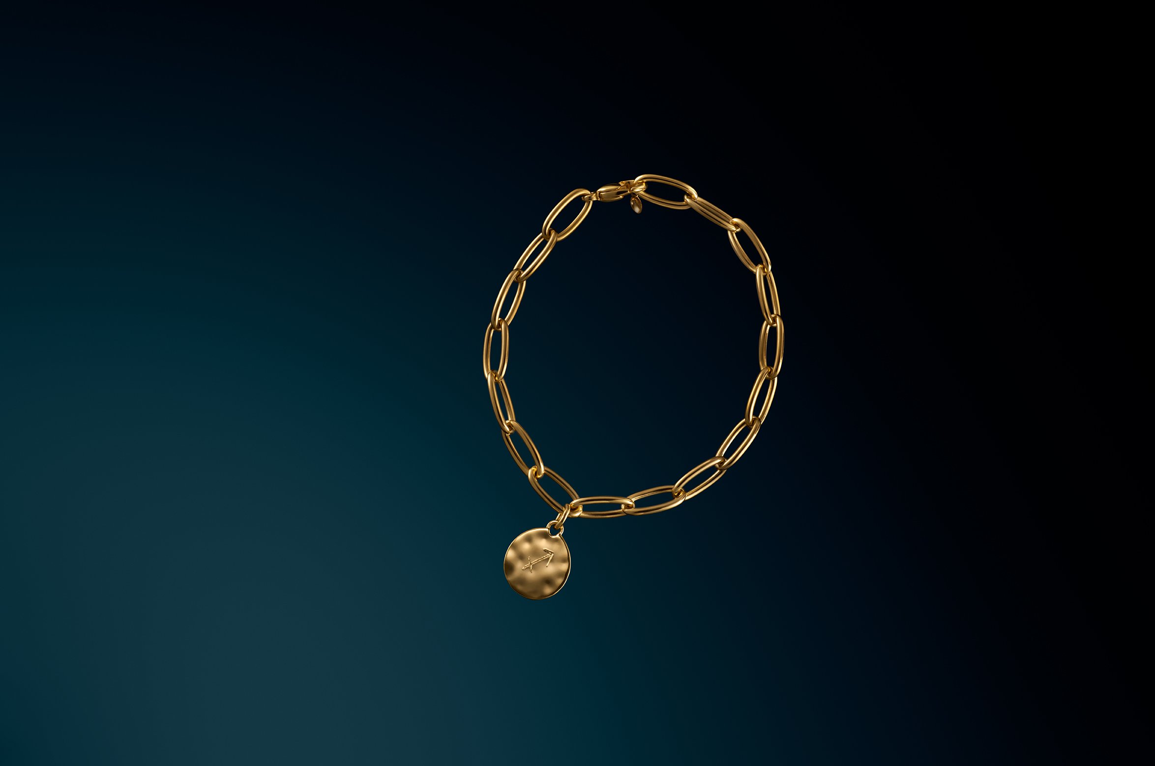 SHOT_13_IDOvalCharmBracelet copy.jpg
