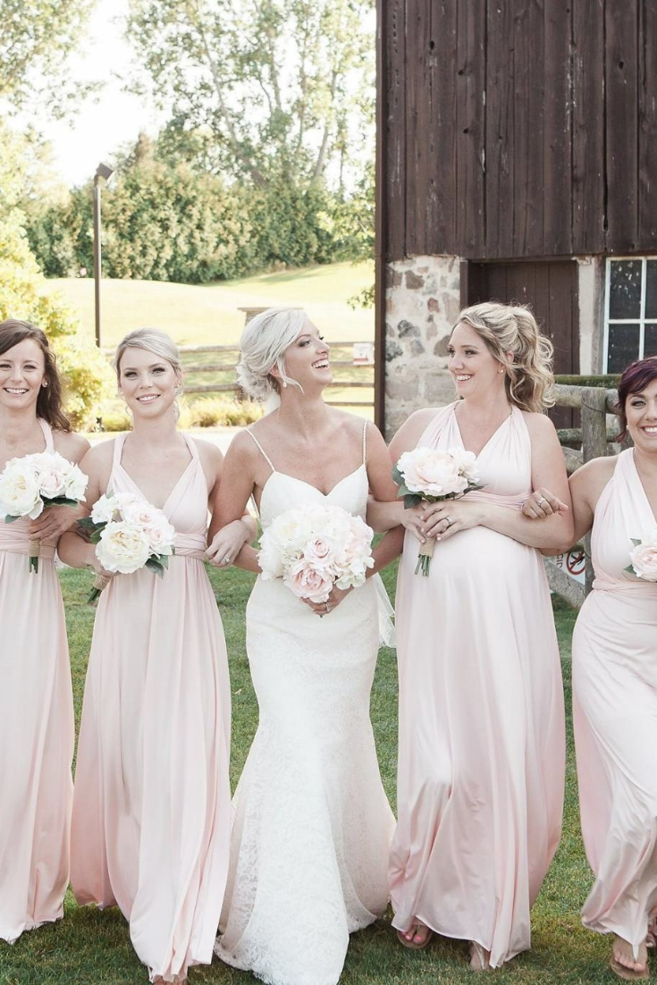blush wedding dress with bridesmaids