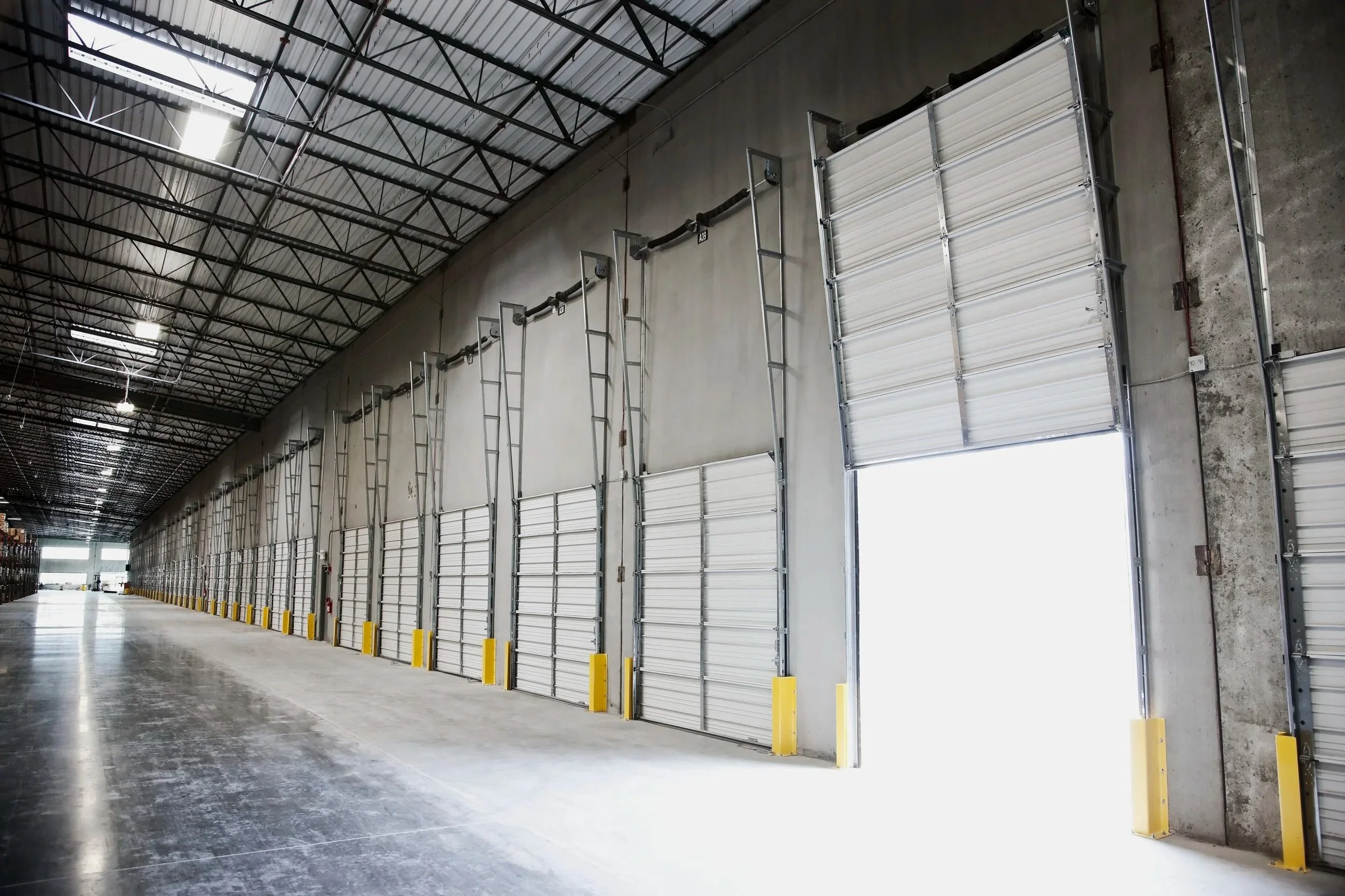 open-door-at-loading-dock-in-warehouse-2025-04-04-04-58-55-utc.jpg