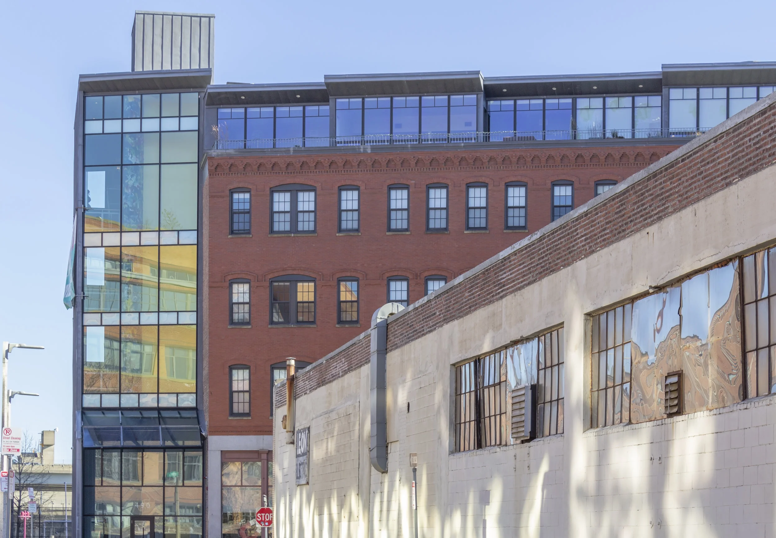 Glass and Brich Office Building and Old Beige Warehouse.jpg
