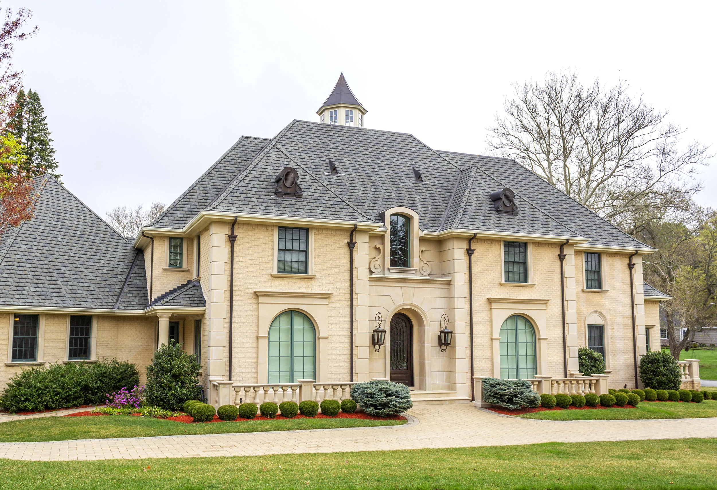 Yellow French Country Style Mansion with Slate Roof.jpg