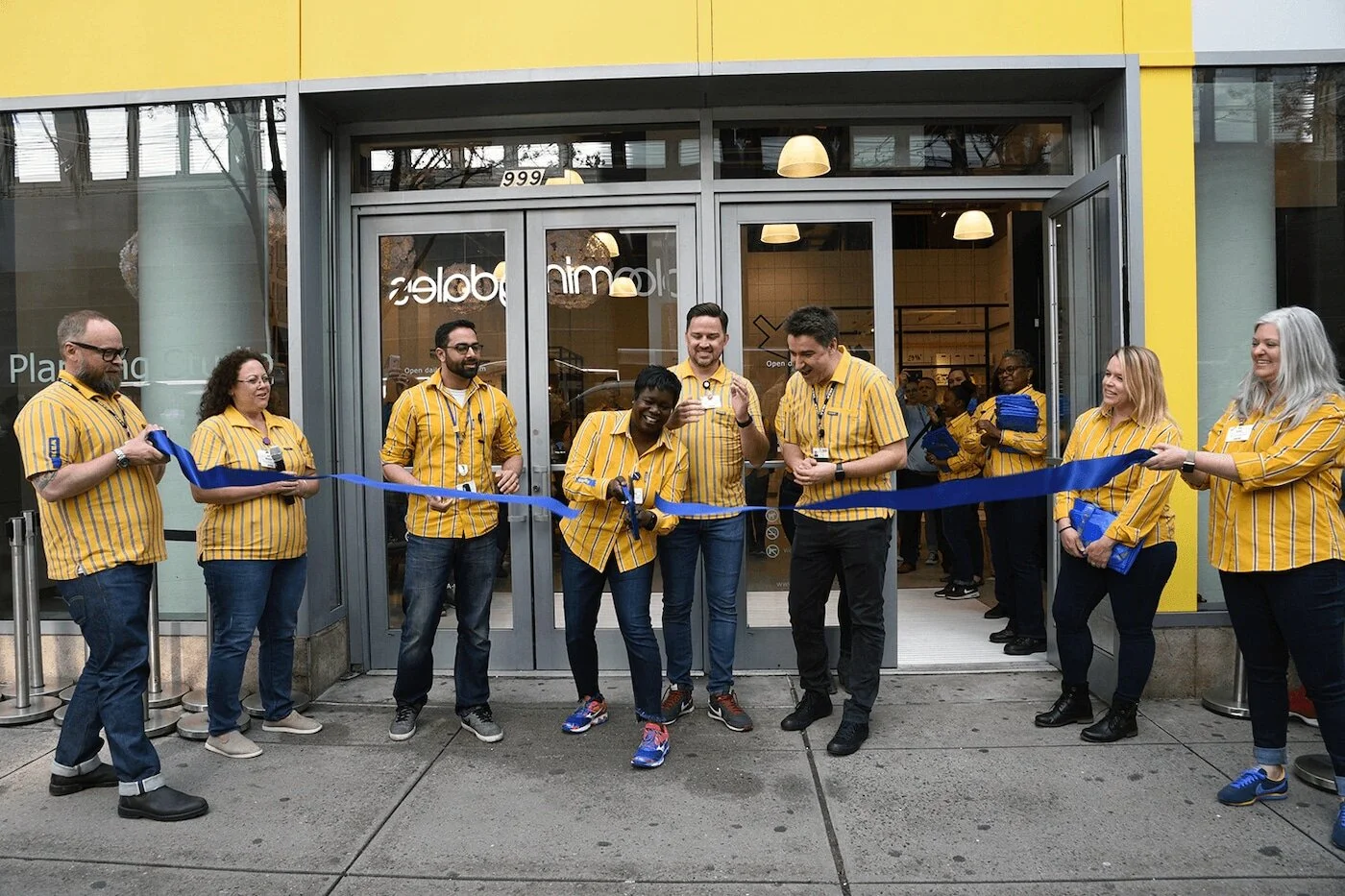several-ikea-co-workers-in-yellow-uniforms-standing-in-front-43684938505eb0e6ff4d9c4ce67ba214.png.jpeg