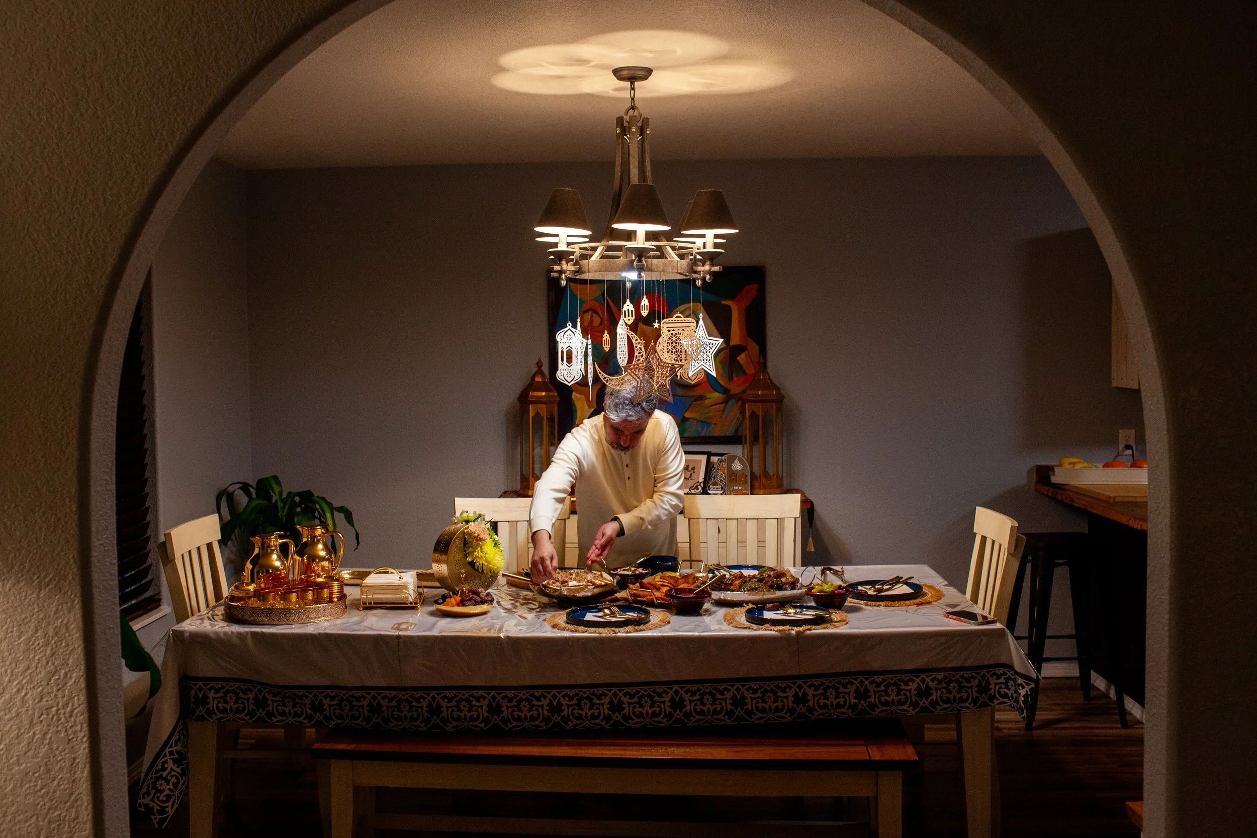  Wisam Raheem sets the table for his family during Ramadan in Missoula, Montana, on Tuesday, April 8, 2024. Wisam moved to the US and applied for asylum from the United Arab Emirates with his wife and kids in 2017. He was forced to leave his home in 