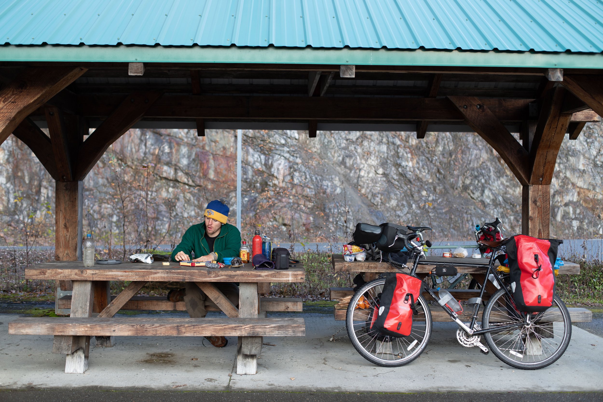 Walter setting up Settlers of Catan at a rest stop near Haines, Alaska.